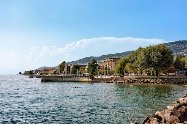 Quay of Geneva Lake at Vevey, Swiss Riviera. Alps mountains on the background