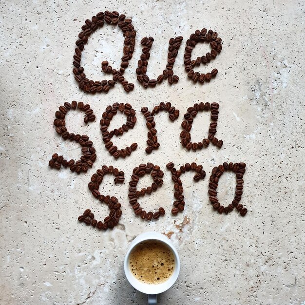 Que sera seradirectly above shot of text coffee bean art