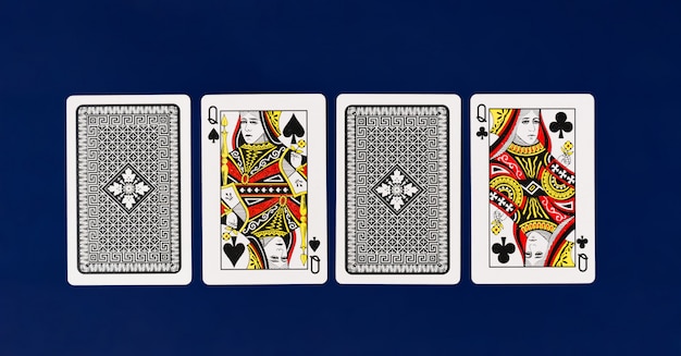 Queen playing cards with plain blue background for poker and\
casino copyspace