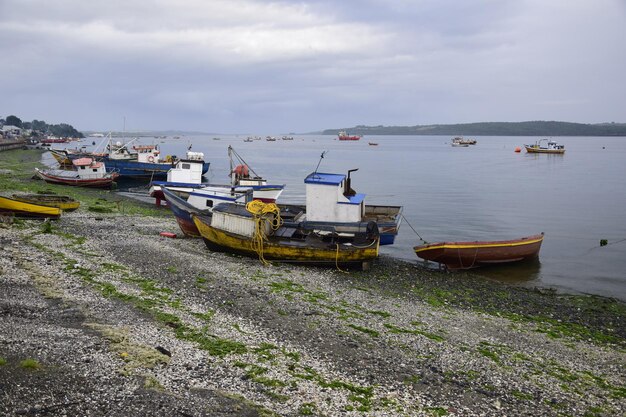 QUELLON CHILE Colourful fishing boats in the coastal town of Quellon on the island of Chiloe in Chile