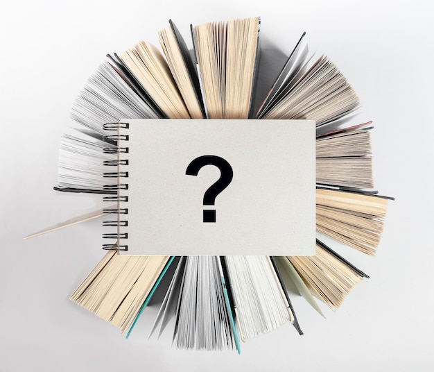 Question mark on books knowledge and curiosity concept