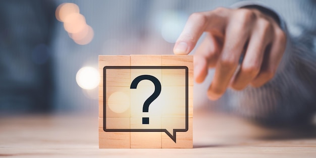 Question mark on wooden block Questioning concepts why where when