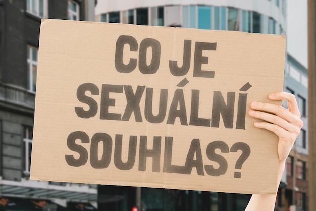 The question What is sexual consent on a banner in men's hands with blurred background Intimacy Intimate Sex Adult Law Relationship Love Legality