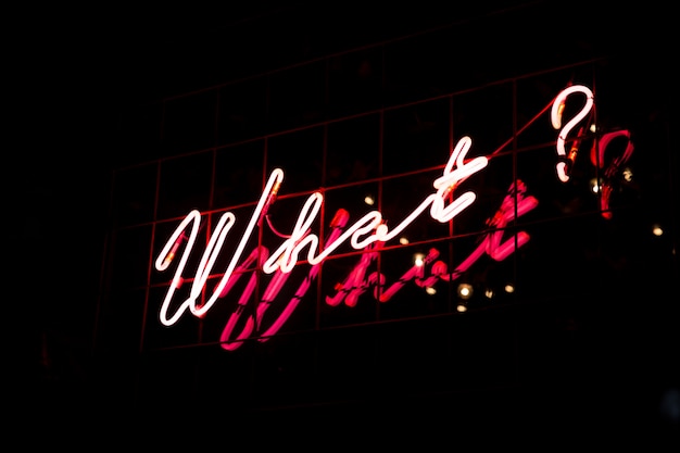 Question What in red neon color on black background.