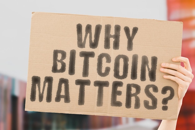 The question Why bitcoin matters on a banner in men's hands with blurred background Banking Equal Saving Vision Budget Web Growth Future Plan Mission Investment Innovation Leadership