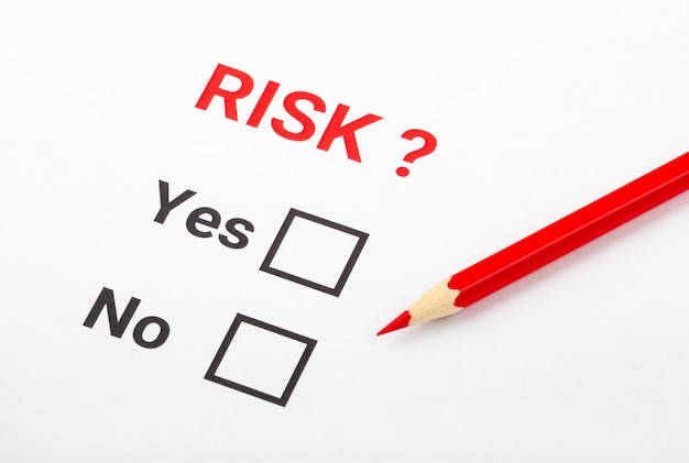 Questionarie about risk on white paper.