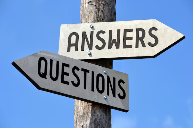 Photo questions and answers wooden signpost with two arrows