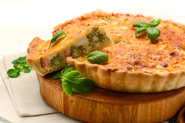 Quiche pie with salmon spinach and cheese