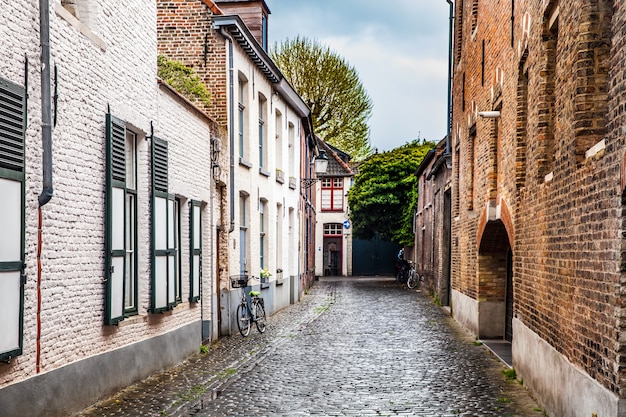 Quiet courtyard, typical architecture of bruges city, belgium