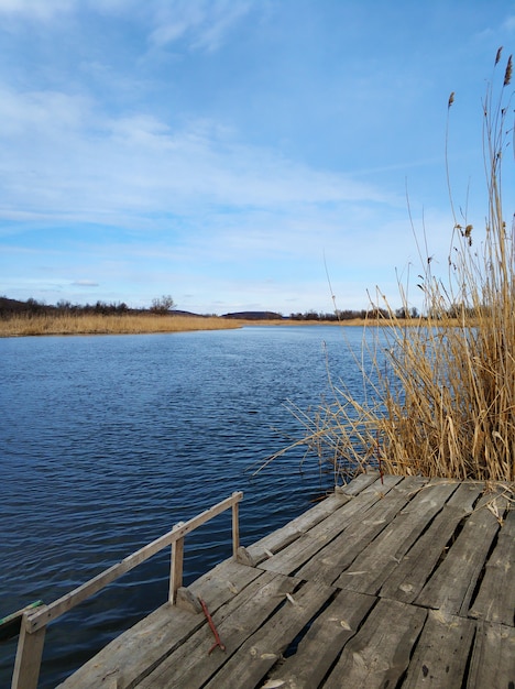 Quiet fishing spot by the river. View of the river from the bank.