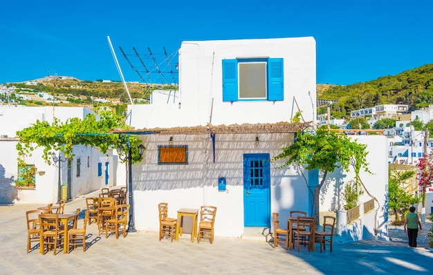 Quiet traditional greek street with white houses