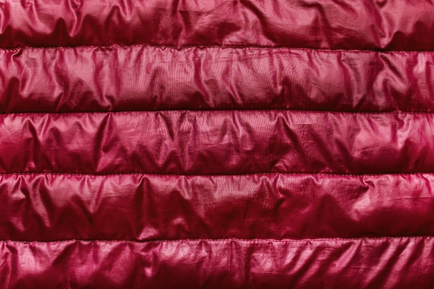 Quilted maroon fabric as a background