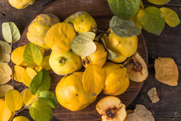 Quince fruits on a wooden background harvest of autumn fruits