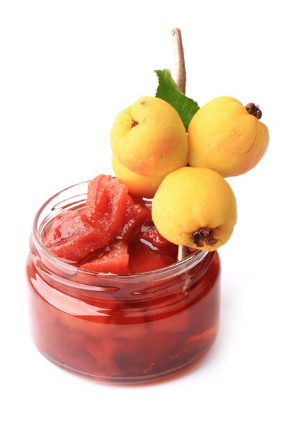 Quince jam isolated on a white background