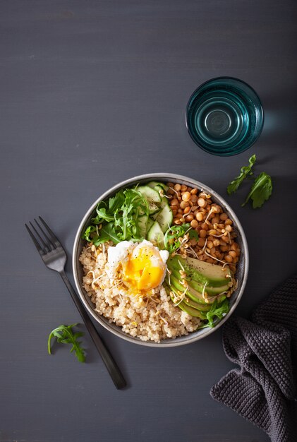 Quinoa bowl with egg, avocado, cucumber, lentil. Healthy vegetarian lunch