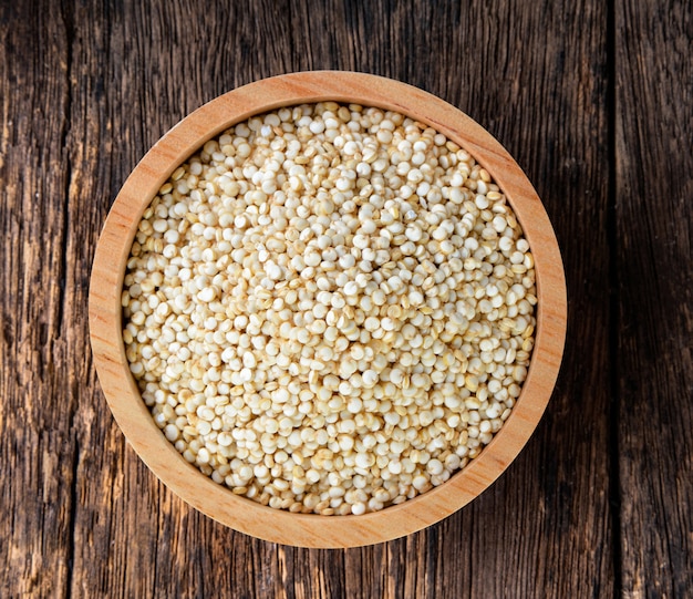 Quinoa in a bowl on wood table