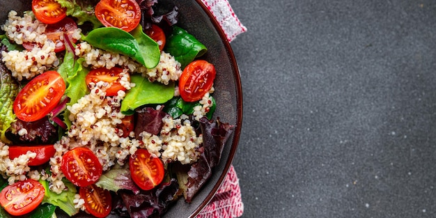 quinoa salad tomato green leaf mix healthy meal food snack on the table copy space food background