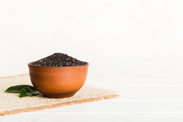 Quinoa seeds in bowl on colored background Healthy kinwa in small bowl Healthy superfood