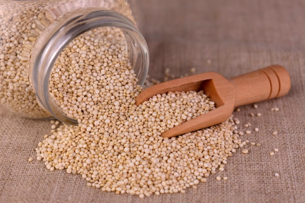 Quinoa seeds poured out of a jar Closeup