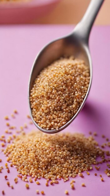 Quinoa seeds in spoon on colored background healthy kinwa in small spoon healthy superfood