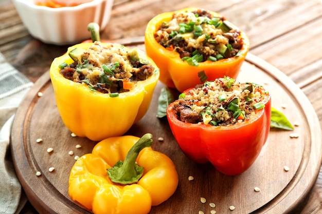 Quinoa stuffed peppers on wooden board