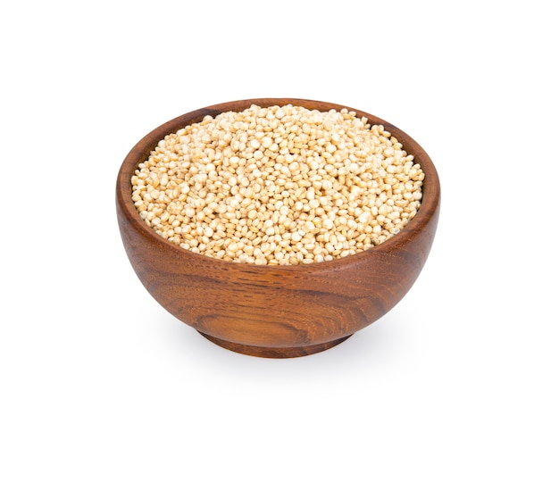 Quinoa in a wooden bowl isolated on white