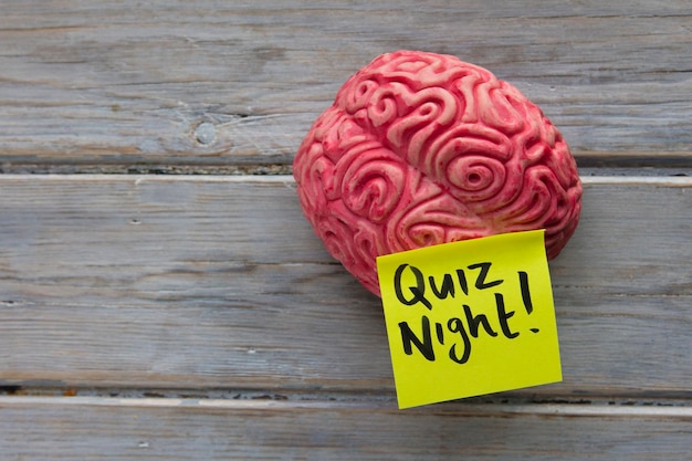 Quiz night label stuck on a brain