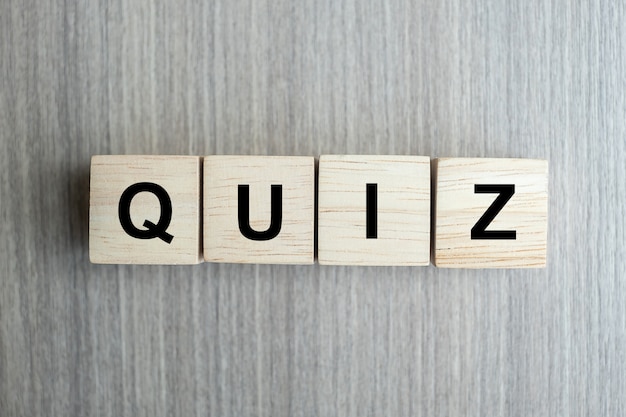 QUIZ text wood cube   on wooden table 