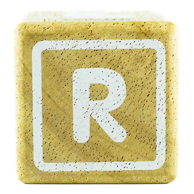 R text letters written on wooden cubes