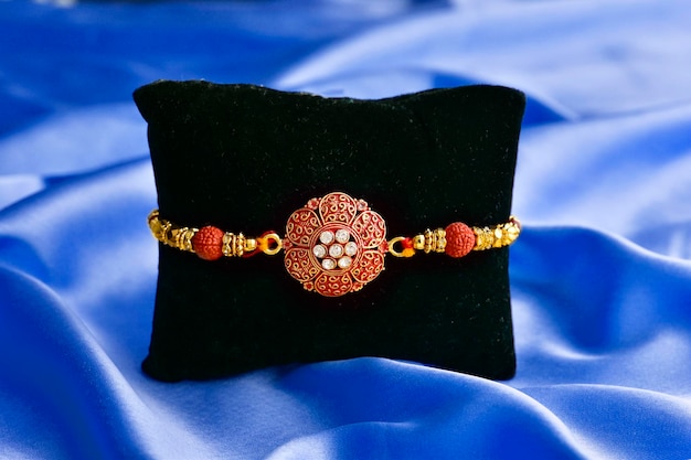 Raakhi tie on black cushion raksha bandhan concept