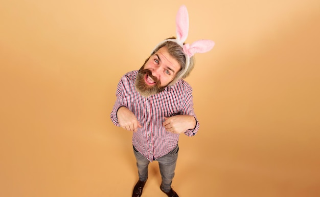 Rabbit man easter day celebration funny bearded man in bunny ears easter man bearded guy in bunny