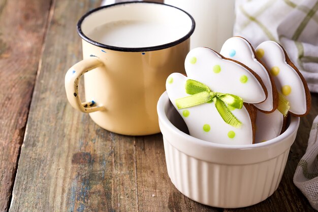 Rabbit shaped Easter cookies, hand-made with cup of milk. 