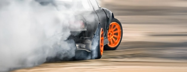 Race drift car burning tires on speed track