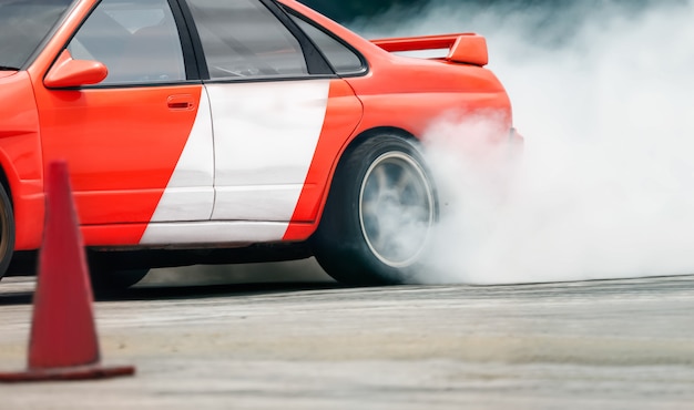 Photo race drift car burning tires on speed track