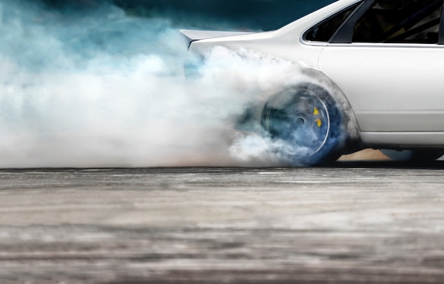 Race drift car burning tires on speed track