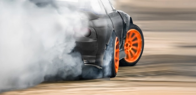 Race drift car burning tires on speed track