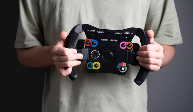 A race driver holding a sport car steering wheel