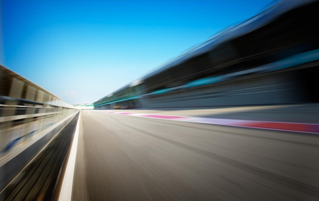 Racetrack in motion blur, racing sport background .