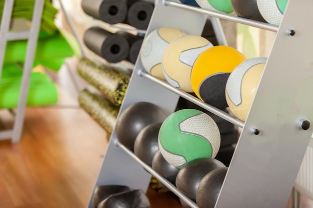 Rack with medicine balls in the gym