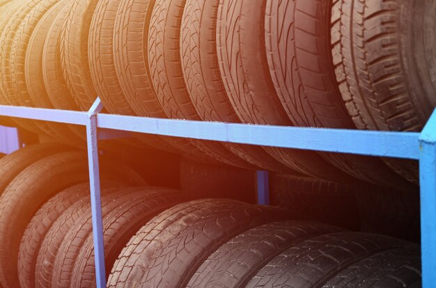 Rack with variety of car tires in automobile store