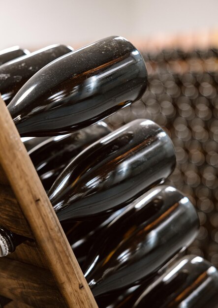 Racked wine bottles aging in winery cellar