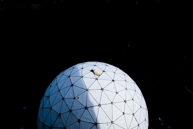 Photo radar dome against black background