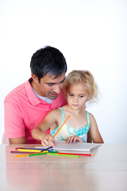 Radiant father drawing with his daughter