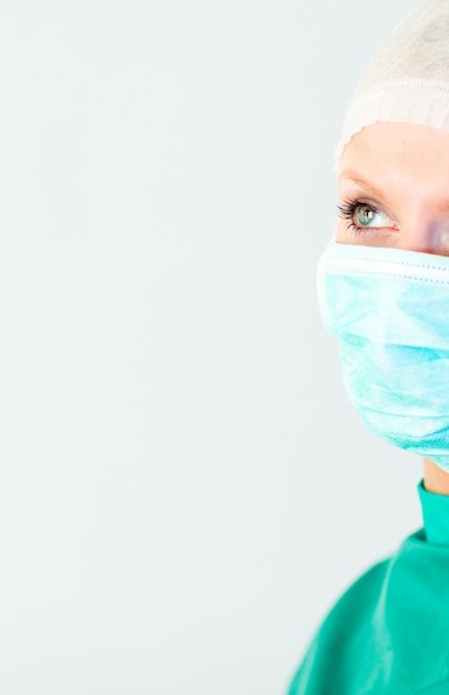 Radiant female doctor with a mask 