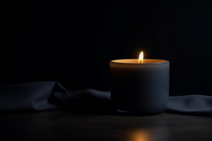 Photo radiating single lit candle against a dark background generative ai