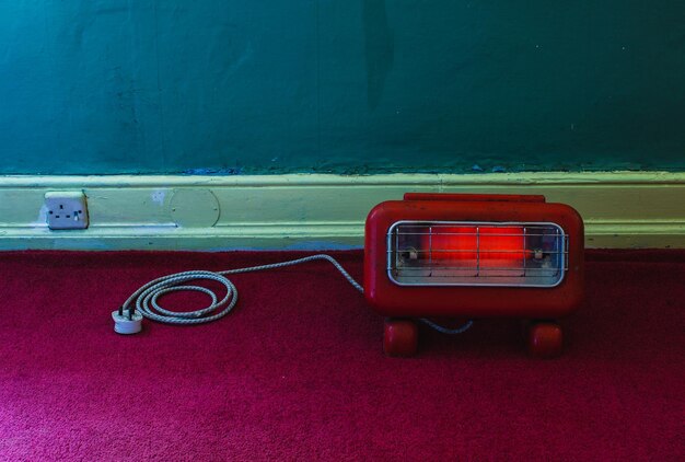 Photo radiator against wall in room at home