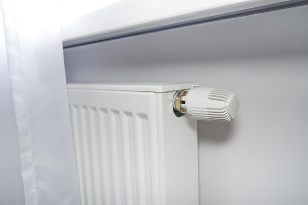 Radiator at home White radiator with temperature adjuster