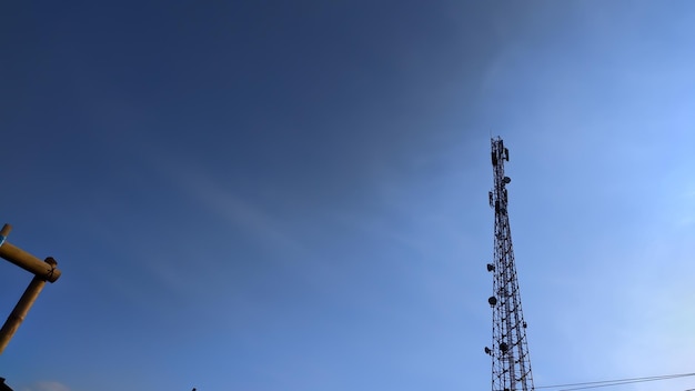 A radio tower against a blue sky background