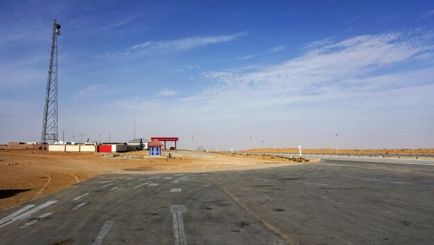 Radio tower and gas station in the desert