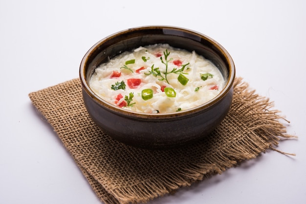 Radish Raita or Daikon or Mooli Koshimbir served in a bowl over moody background. Selective focus. Indian healthy food